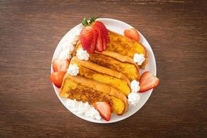 french toast with fresh strawberry and whipping cream photo