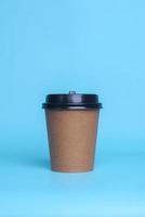 Disposable paper cup isolated on blue background. Realistic set mock up for branding,  template for your design, presentation, promo, ad photo