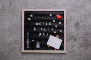 Framed World health day flat lay composition on cement texture background photo