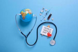 Creative flat lay composition of world health day on pastel blue background photo