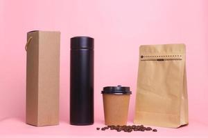 Realistic set mock up isolated on pink background for bakery shop or coffee shop, take away cup, zipper pouch standing, black tumbler and pastry bag  for branding. photo