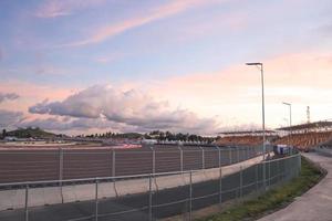 LOMBOK, INDONESIA-MARCH 17, 2021 VIP tribune in colorful audience seats of Mandalika Circuit for MotoGP and F1 with sunset violet sky photo