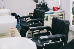 Modern barber shop interior. Minimalist black and white theme photo