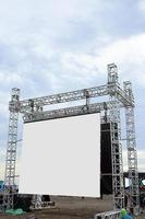 Large blank open-air outdoor white screen for public event such as presentation, concert, cinema, conference, movie, festival, show. Mock up for advertisement photo