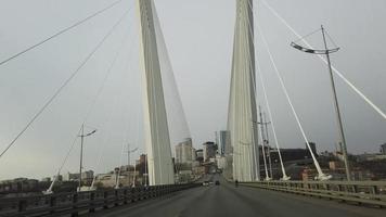 Vladivostok, Russia-March 28, 2020 - traffic on the Golden bridge. video