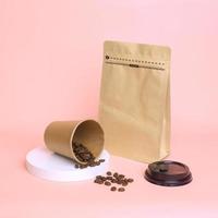 Close-up of coffee set packaging. Take away cup and pouch standing with zip lock isolated on pink background. Realistic set mock up for branding,  template for your design, presentation, promo, ad. photo