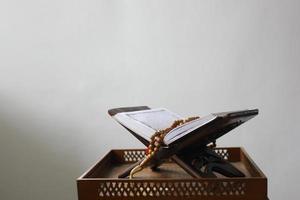 Al quran on table isolated on white background. Islamic concept photo