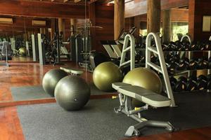 Yoga ball and sport equipments at the front of mirror in fitness room facilites. Bali Indonesia, December 2021 photo