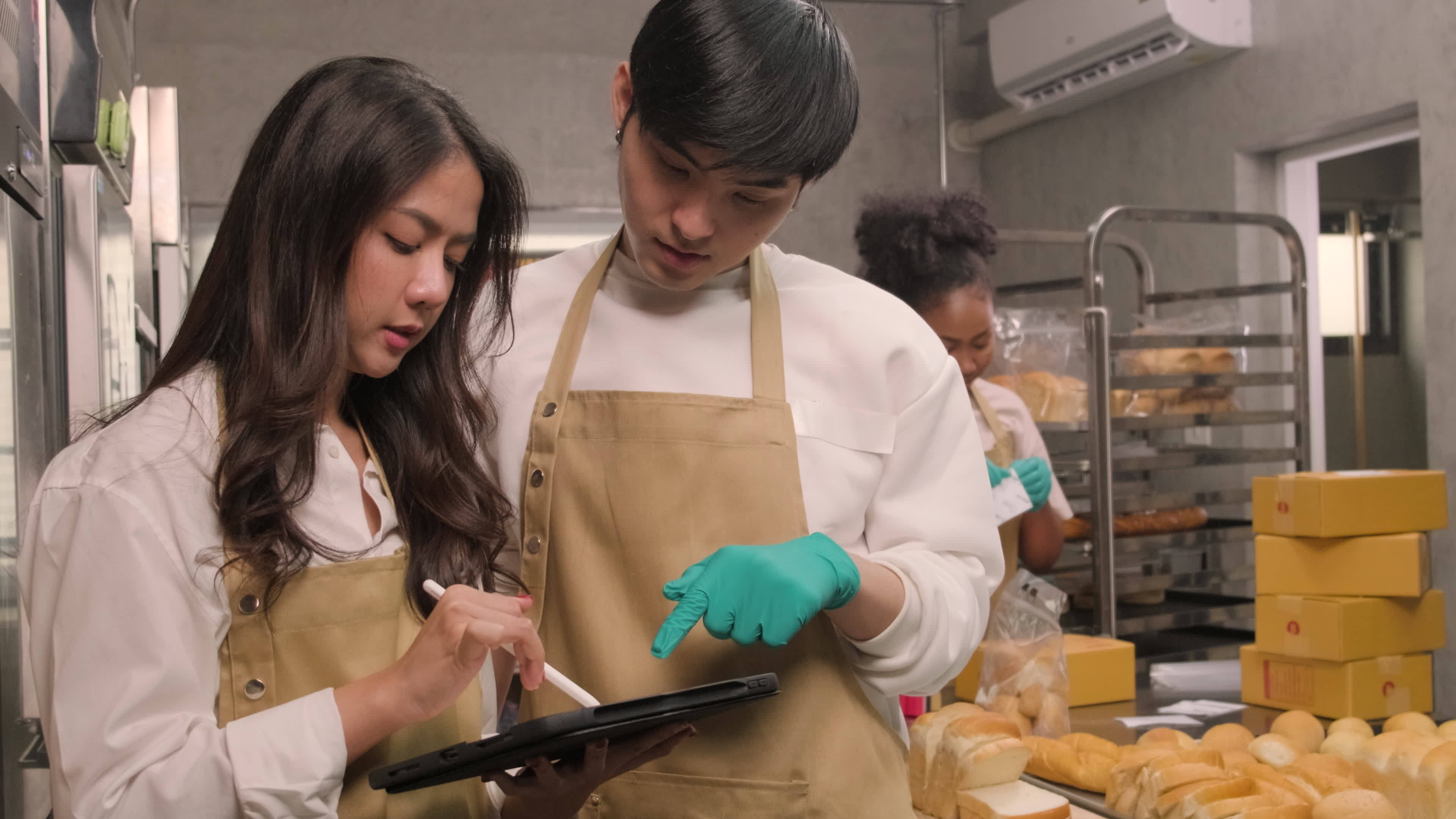 Three young friends and startup partners of bread dough and pastry