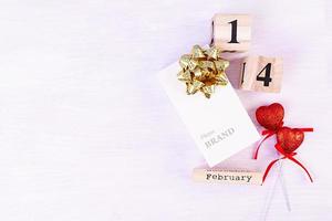 Valentine day. Wooden calendar with February 14 on it. photo