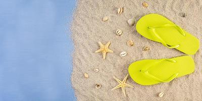 Summer background. Sea sand with seashells, starfish and sunglasses. Summer vacation concept photo