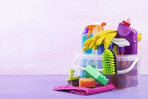 Cleaning service concept. Colorful cleaning set for different surfaces in kitchen, bathroom and other rooms. photo