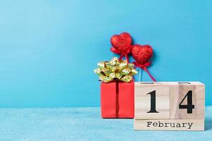 Valentine day. Wooden calendar with February 14 on it. photo