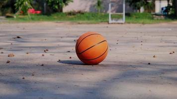 Basketball ball on the outdoors court in the autumn video