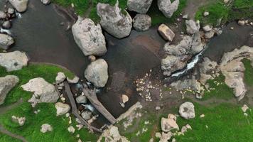 Aerial view of beautiful Water Stream and natural green field of forest in the wild forest mountain ,Clean Air natural fresh Air concept on blue sky fluffy cloud video