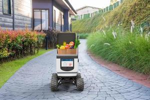 Autonomous robots deliver food to customers, Smart artificial intelligence technology concept photo