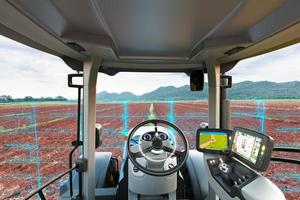 Autonomous tractor scanning agricultural plot, Future technology with smart agriculture farming concept photo