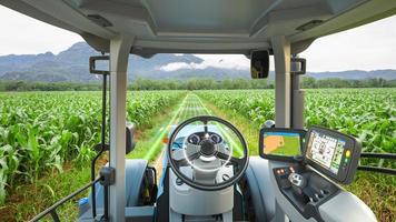 5G autonomous tractor working in corn field, Future technology with smart agriculture farming concept photo