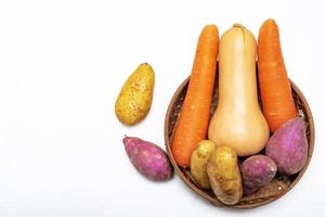 Healthy food butternut squash carrot sweet potato in basket isolated on white background photo