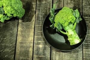 Broccoli vegetable on wood healthy eating clean food concept. photo