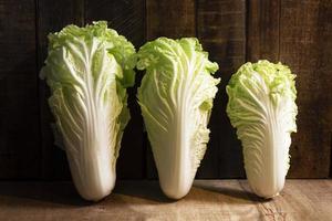 Vegetable food cabbage chinese on wood table. photo