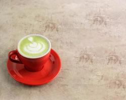 matcha latte on a wooden background photo