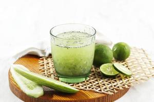 Es Timun Serut, a Typical Indonesian Drink Mde from Shaved Cucumber with Simple Syrup, Lime, and Basil Seeds. photo