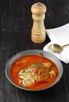 Salmon fish head curry with tomatoes and herbs. photo