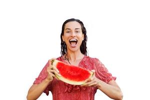 Cheerful woman holding a piece of sliced watermelon. Summer concept photo