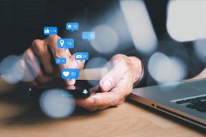 Businessman using smart phone on office desk with copy space, Social, media, Marketing concept. photo