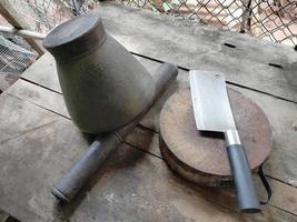 Knives, chopping boards, mortars, rural kitchen items, rustic items for Isaan food, Thai people. photo