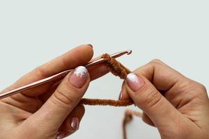 Crochet process of plush yarn. Start knitting a chain of loops photo