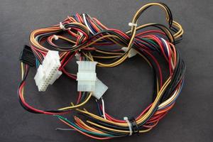 Multi-colored wires from a desktop computer. Wires leading electricity to individual PC components. photo