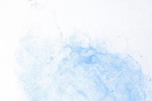 Blue watercolor on white paper photo