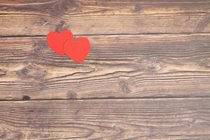 Hearts and gift boxes on wooden floors photo