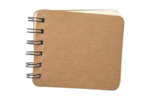 brown notebook isolated on white background photo