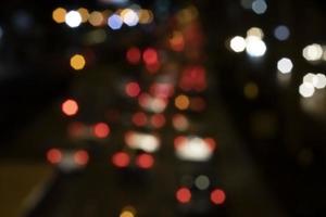 Bokeh, car lights on the night road photo