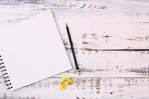 Notebooks and pencils on wooden floors photo