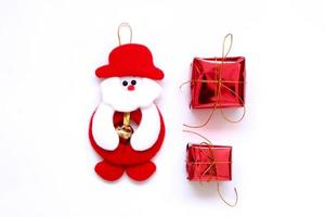 Santa doll and red box, white background photo