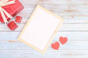 Heart with a gift box and a blank frame photo