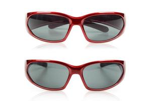 Two separate red glasses on a white background photo