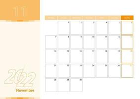 Horizontal planner for November 2022 in the orange color scheme. The week begins on Monday. A wall calendar in a minimalist style. vector