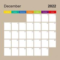 página de calendario para diciembre de 2022, planificador de paredes con diseño colorido. la semana comienza el lunes. vector