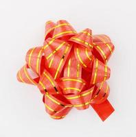 Red ribbon, floral bow on white space, props and designs. - Photo