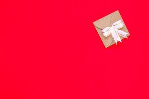 Gift Box on Red Paper on Christmas Concept photo