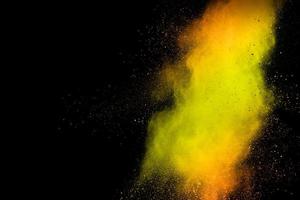 Abstract explosion of orange dust on white background. photo