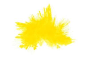 Abstract yellow powder explosion white on  background. Yellow dust particle splashing. photo