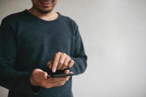 Man using cellphone for searching data and social media on internet. photo