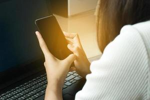 Cropped image of professional business woman working at home office via laptop, manager using portable computer device  work process concept photo