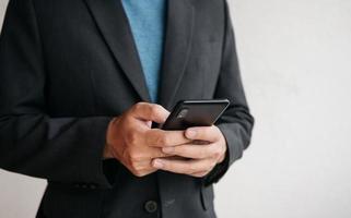 Man using cellphone for searching data and social media on internet. photo